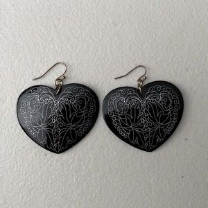Black, heart shaped earrings.